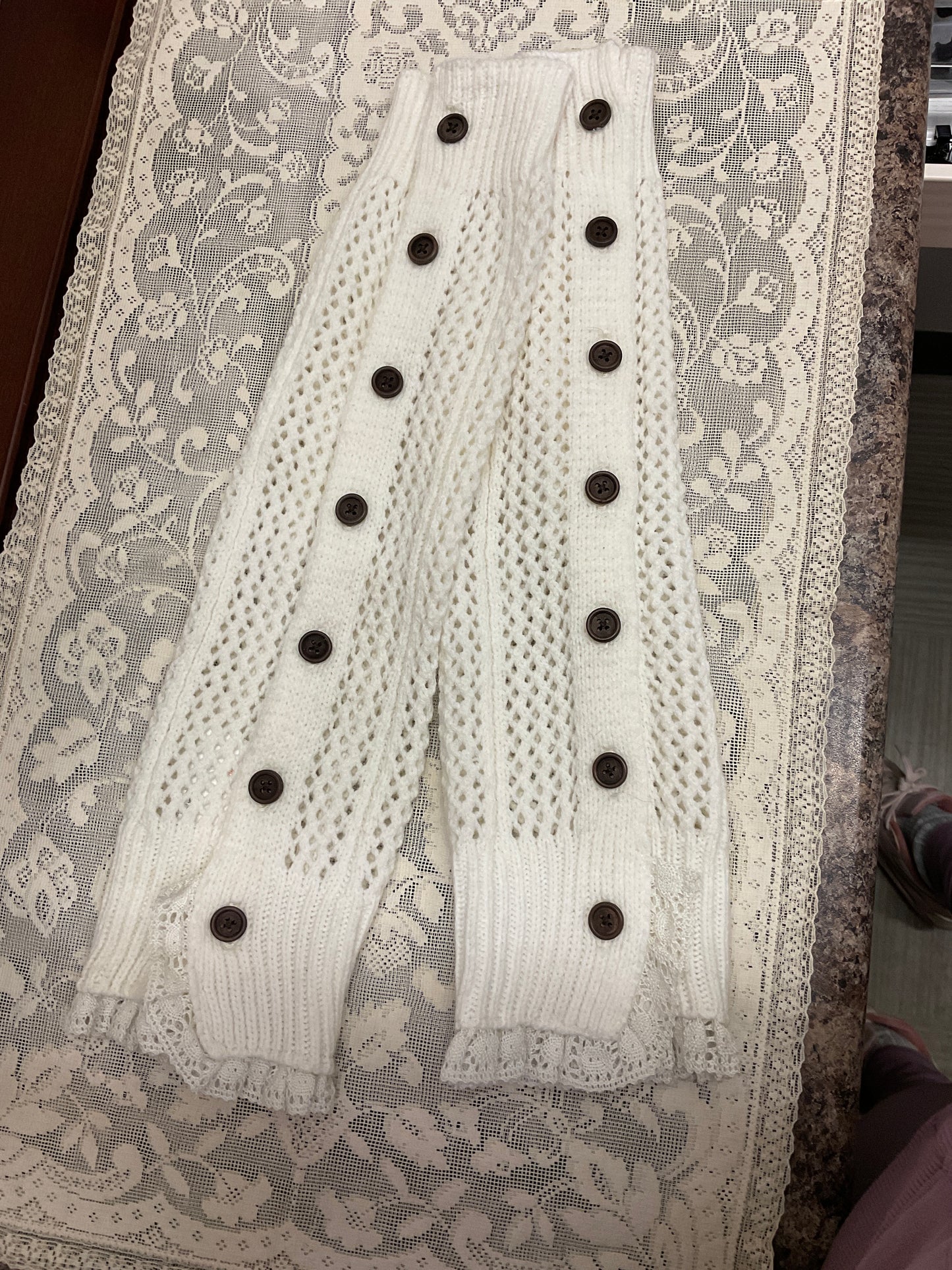 Cream leg warmers with brown buttons and lace trim