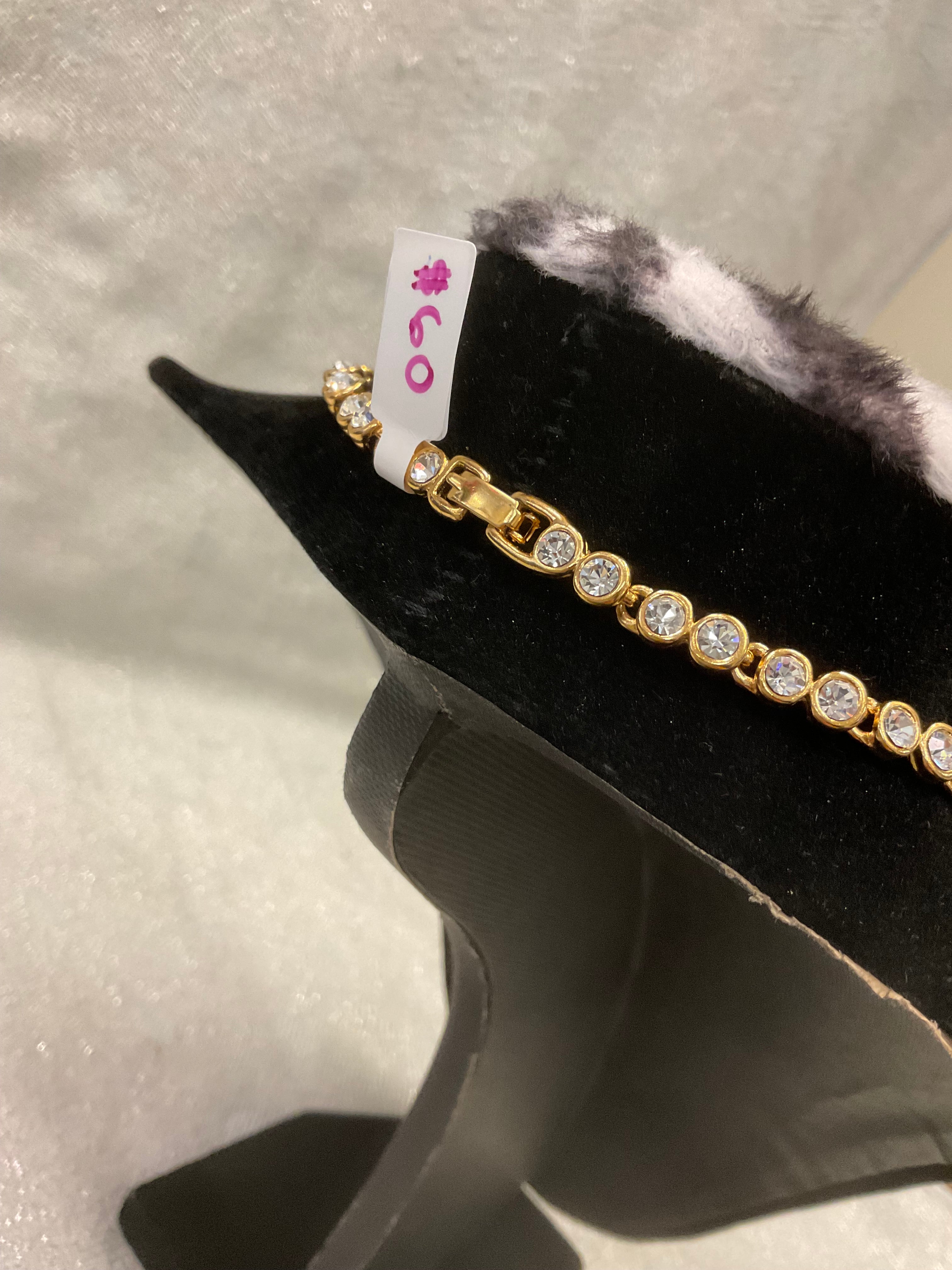 Vintage gold tone rhinestone necklace with large blue teardrop crystal pendant