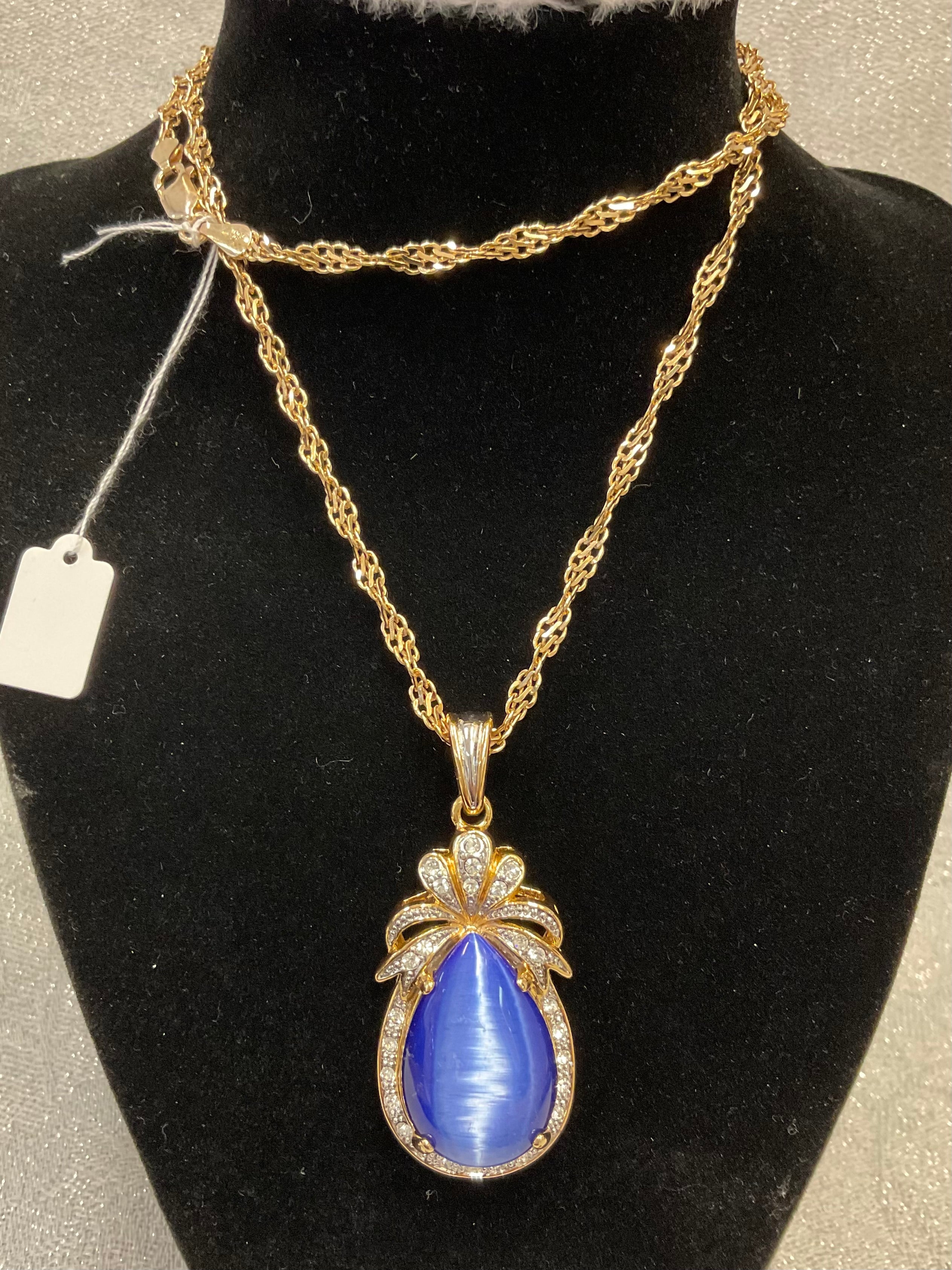 Vintage gold tone necklace with blue sapphire pendant
