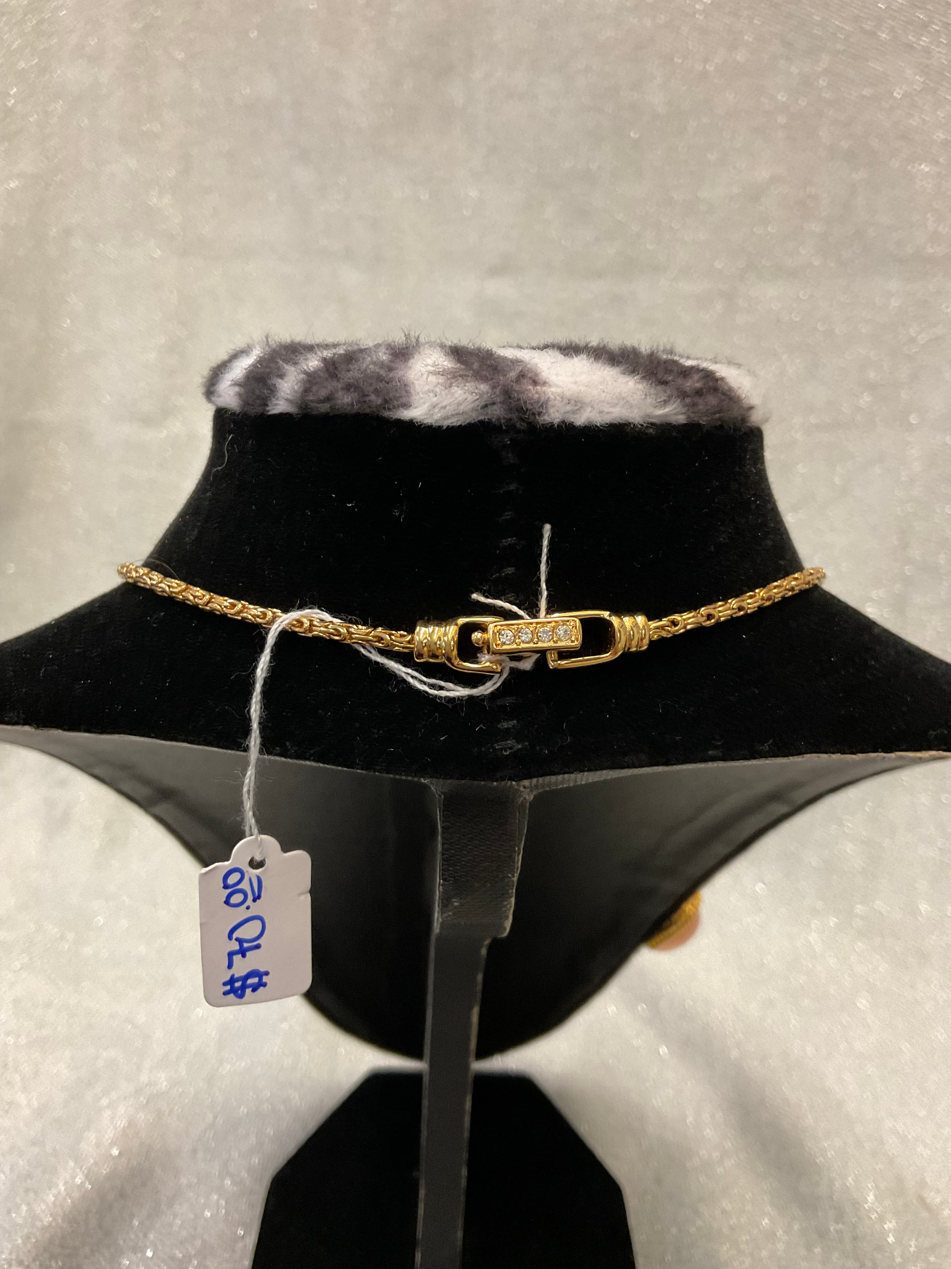 Vintage gold necklace with a pink heart pendant