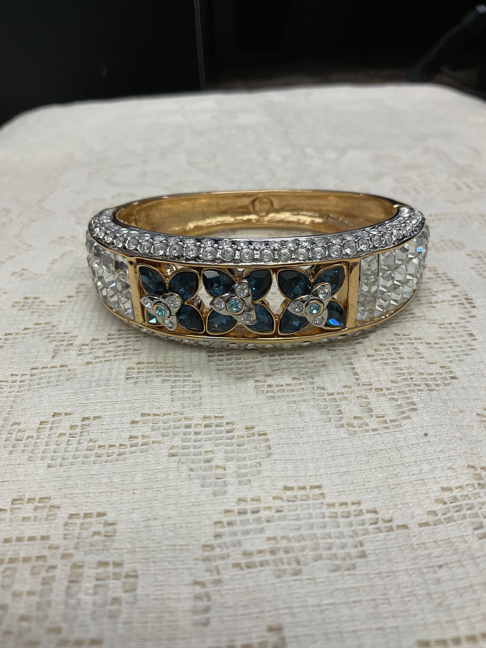 Cz and blue Cz flowers on gold cuff