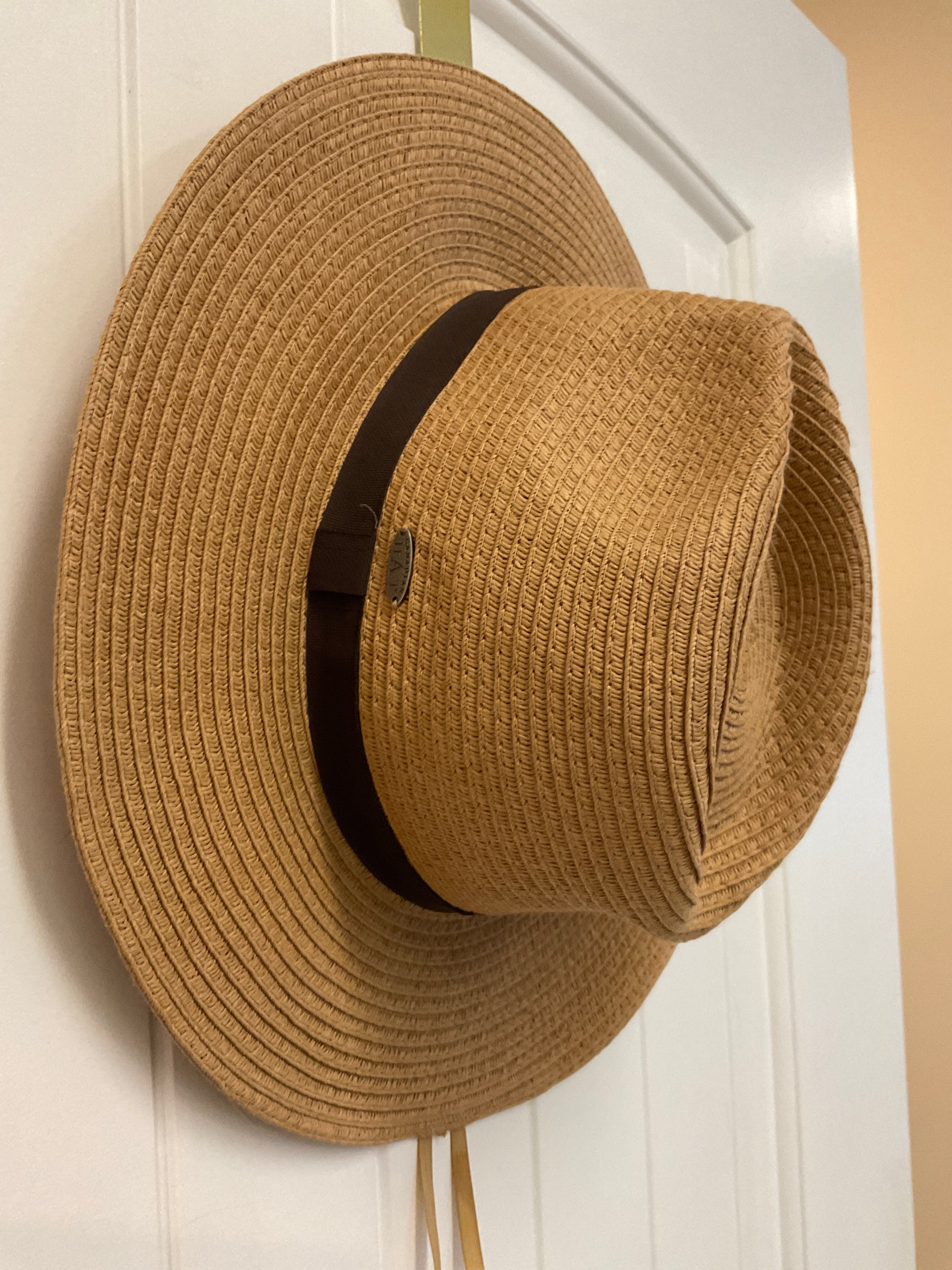 Paper hat with brown ribbon