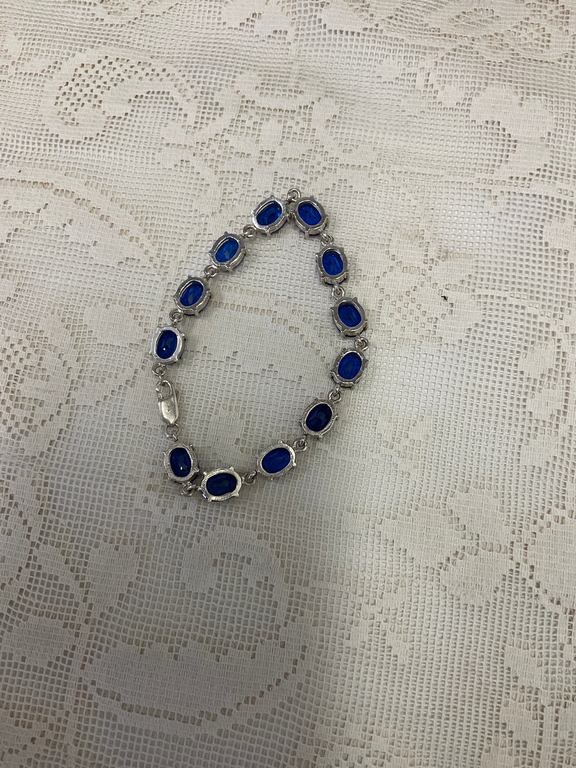 Blue sapphire like gemstones on silver bracelet 925