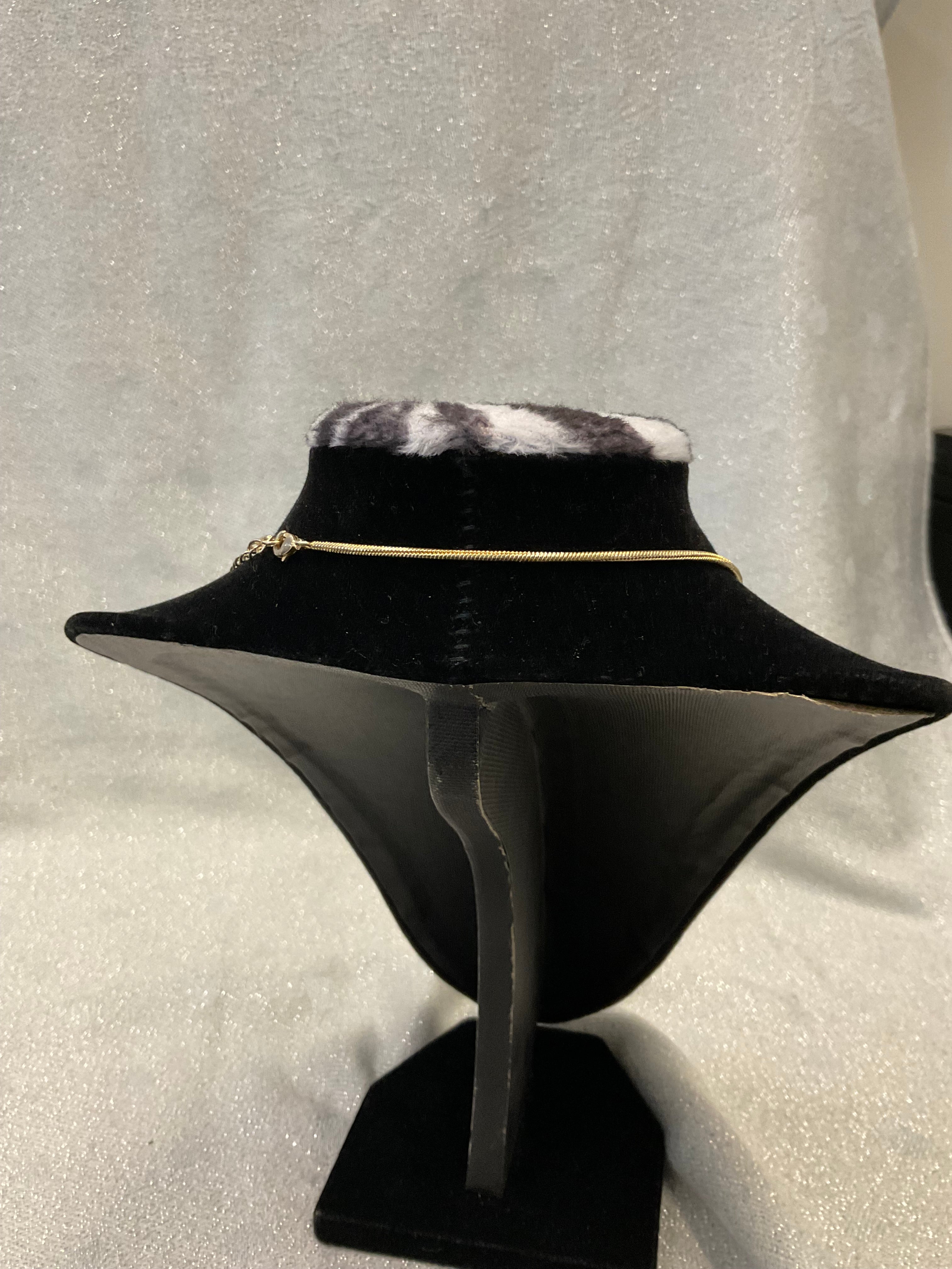 Gold tone necklace with rose pendant