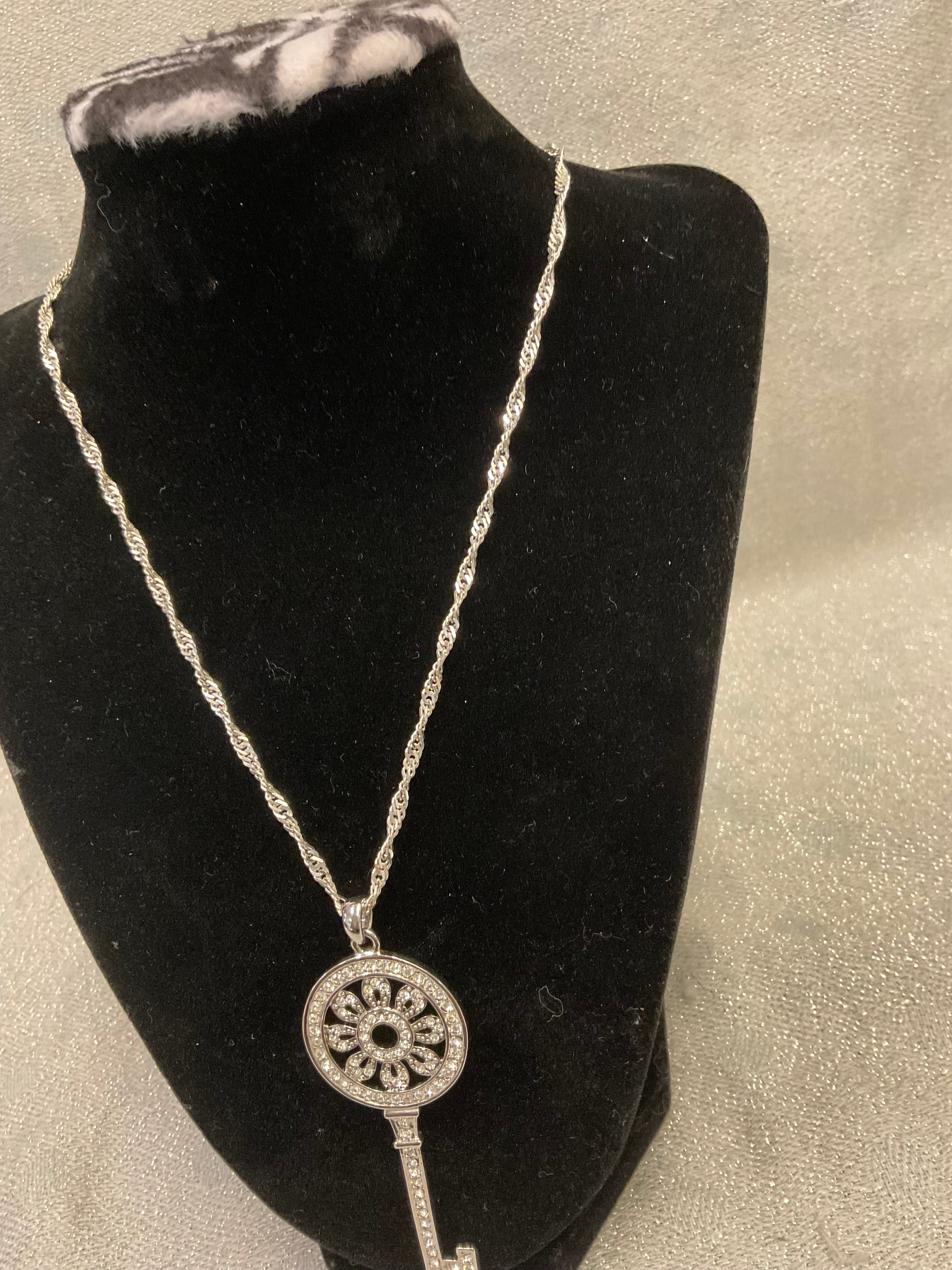 Silver necklace with large key pendant