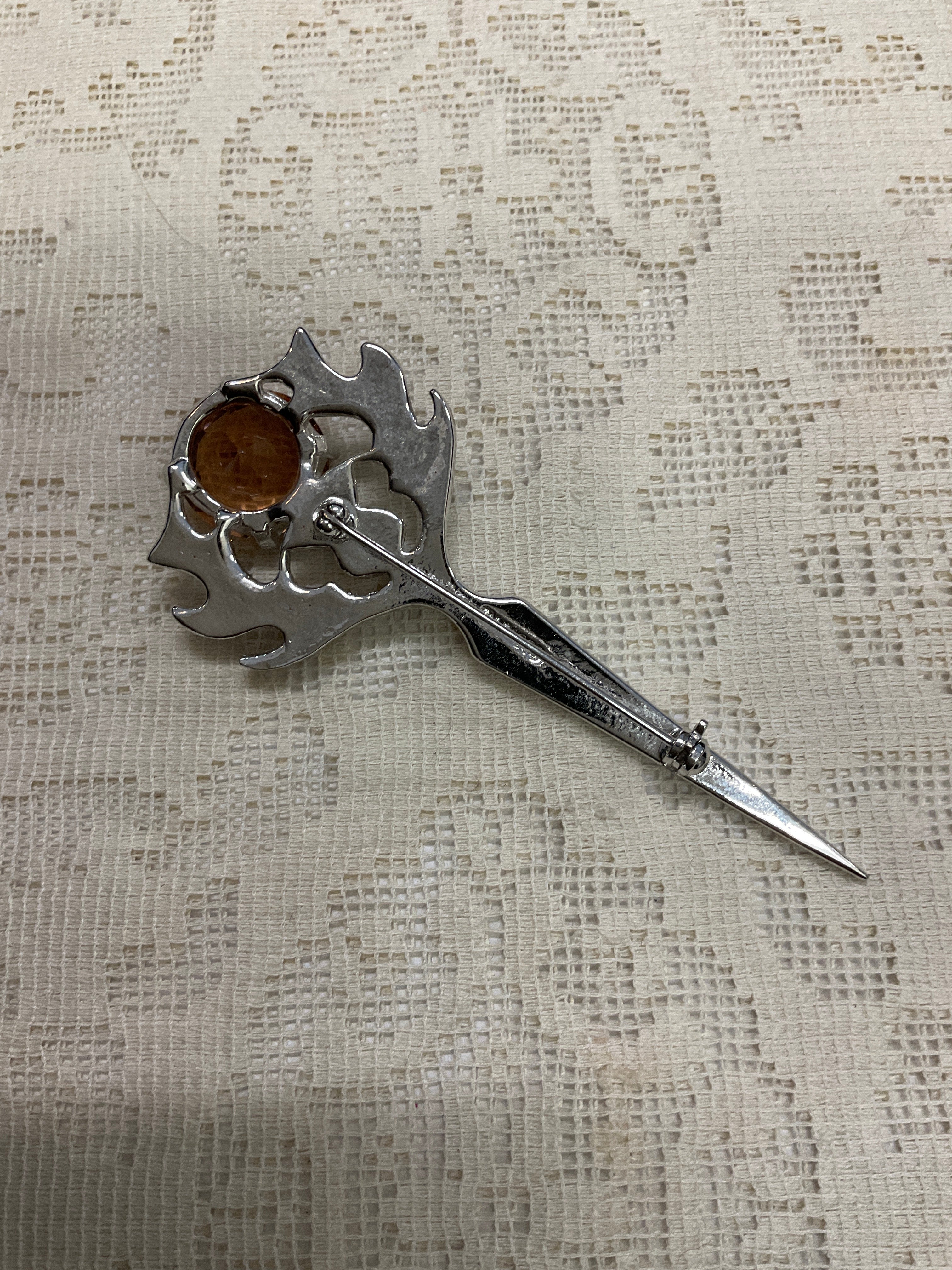 Sword like broach pin