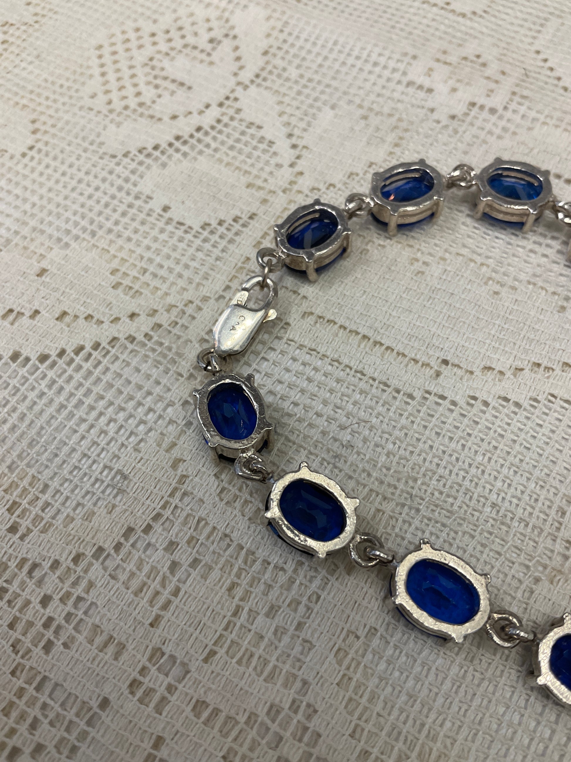 Blue sapphire like gemstones on silver bracelet 925