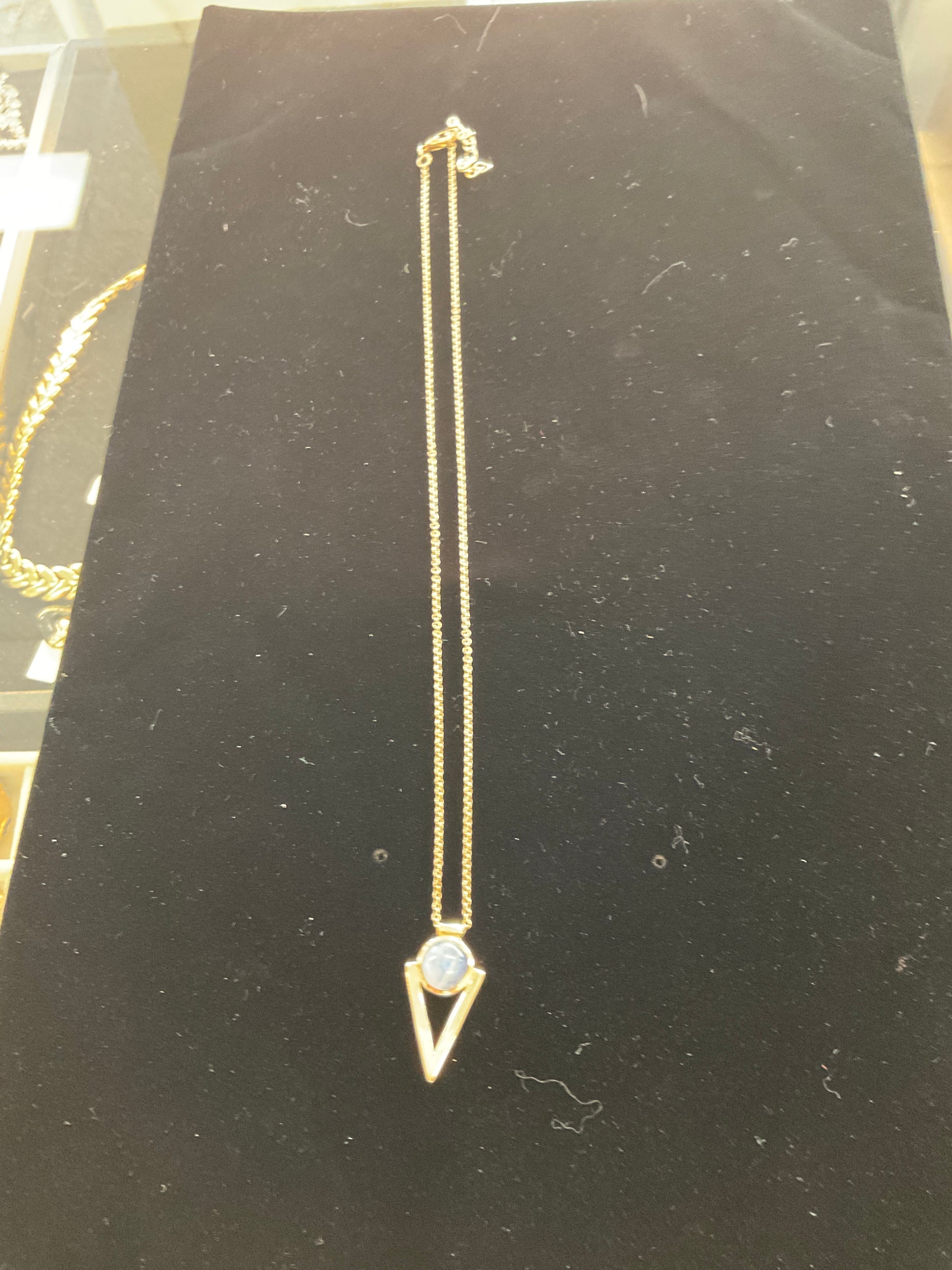 Gold toned with opal pendant