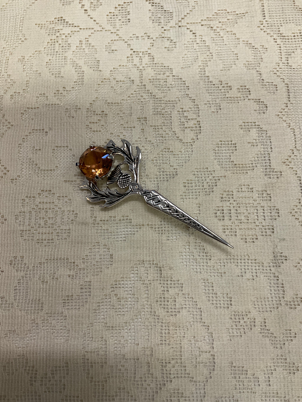 Sword like broach pin
