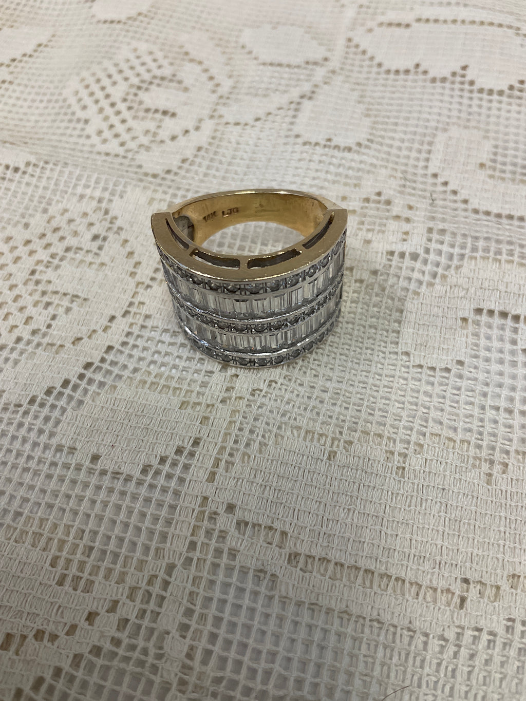 Size 6.5 14k gold with diamond baguettes in white gold setting 9.93 grams