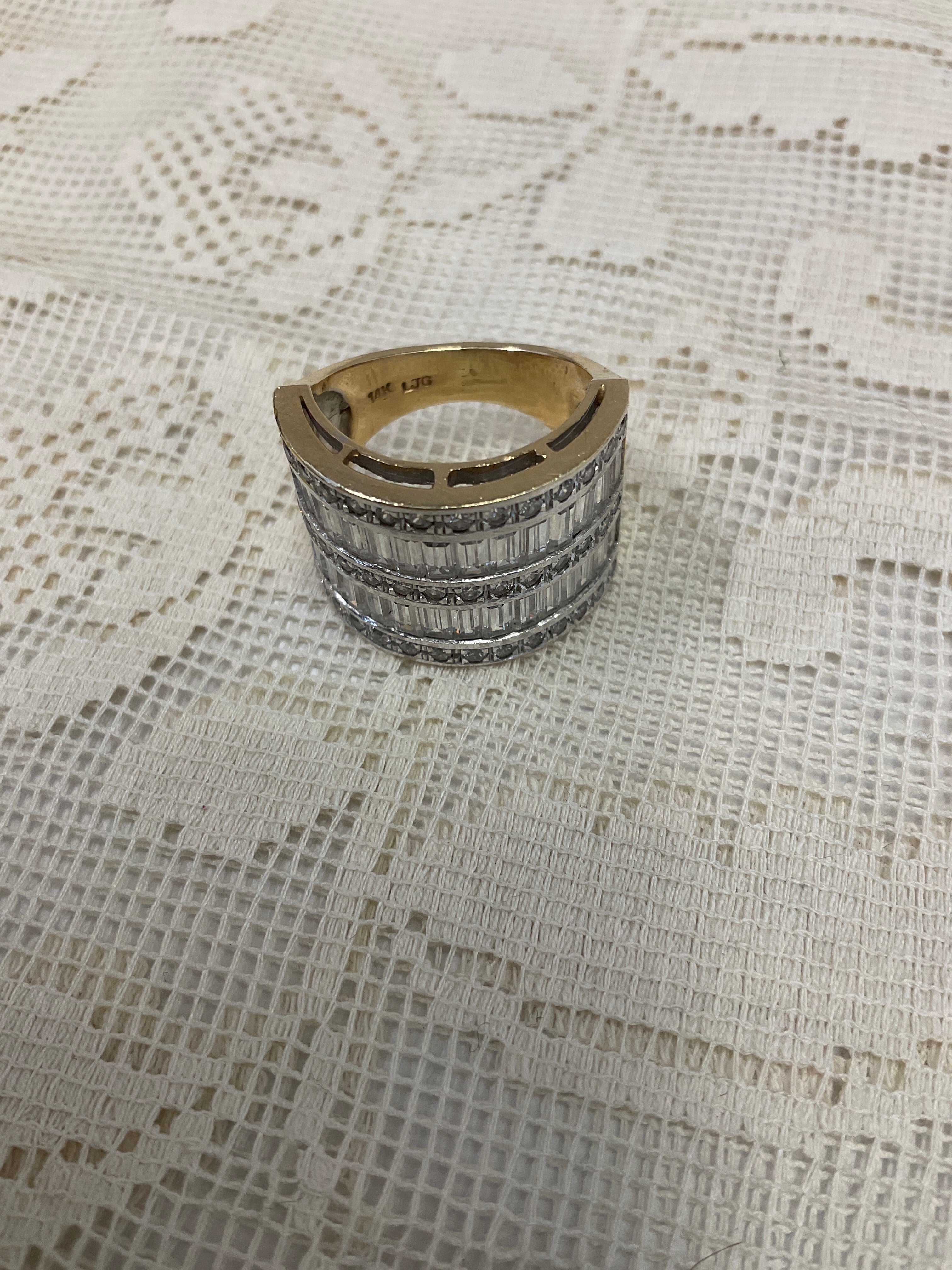 Size 6.5 14k gold with diamond baguettes in white gold setting 9.93 grams