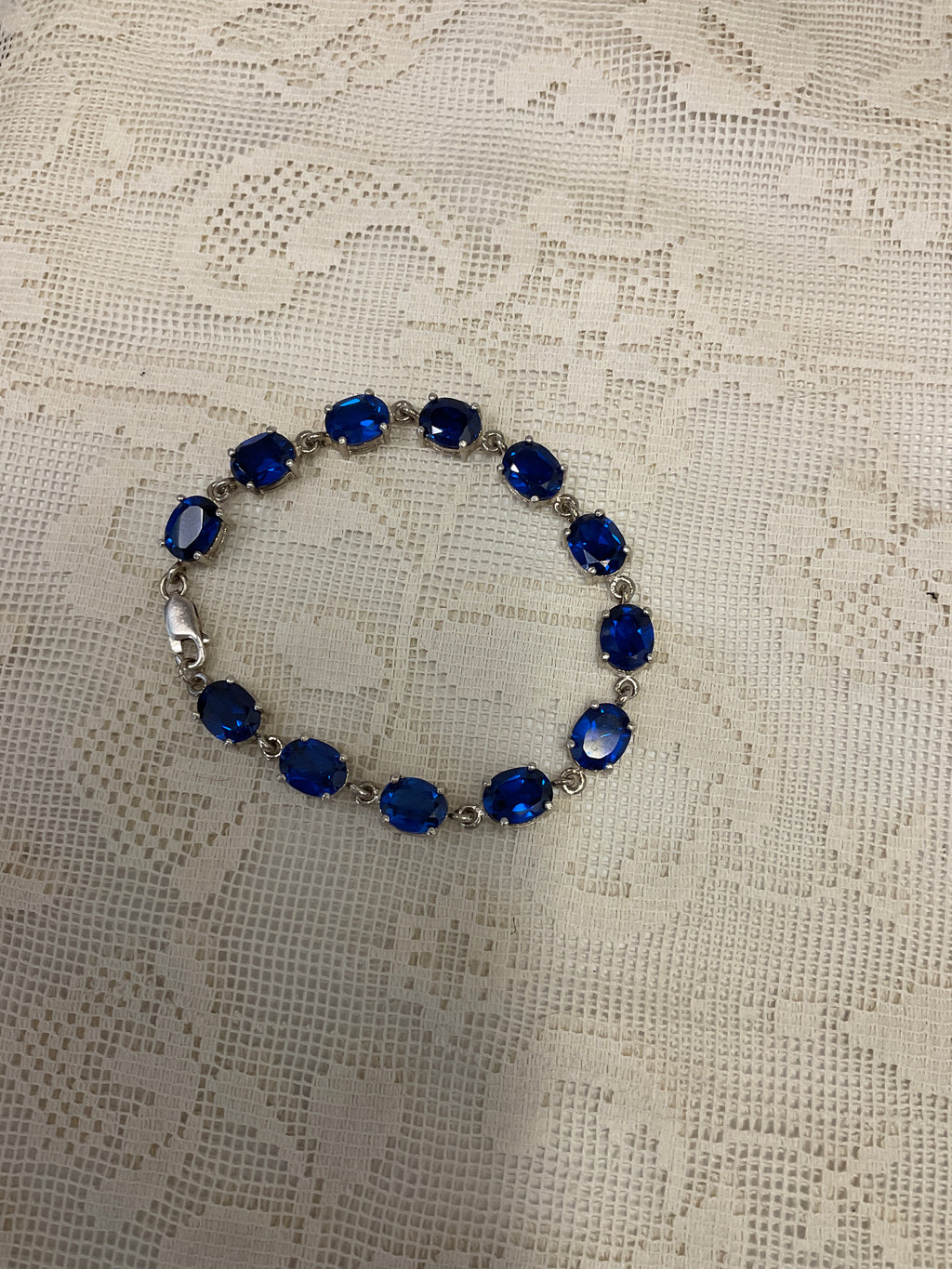 Blue sapphire like gemstones on silver bracelet 925