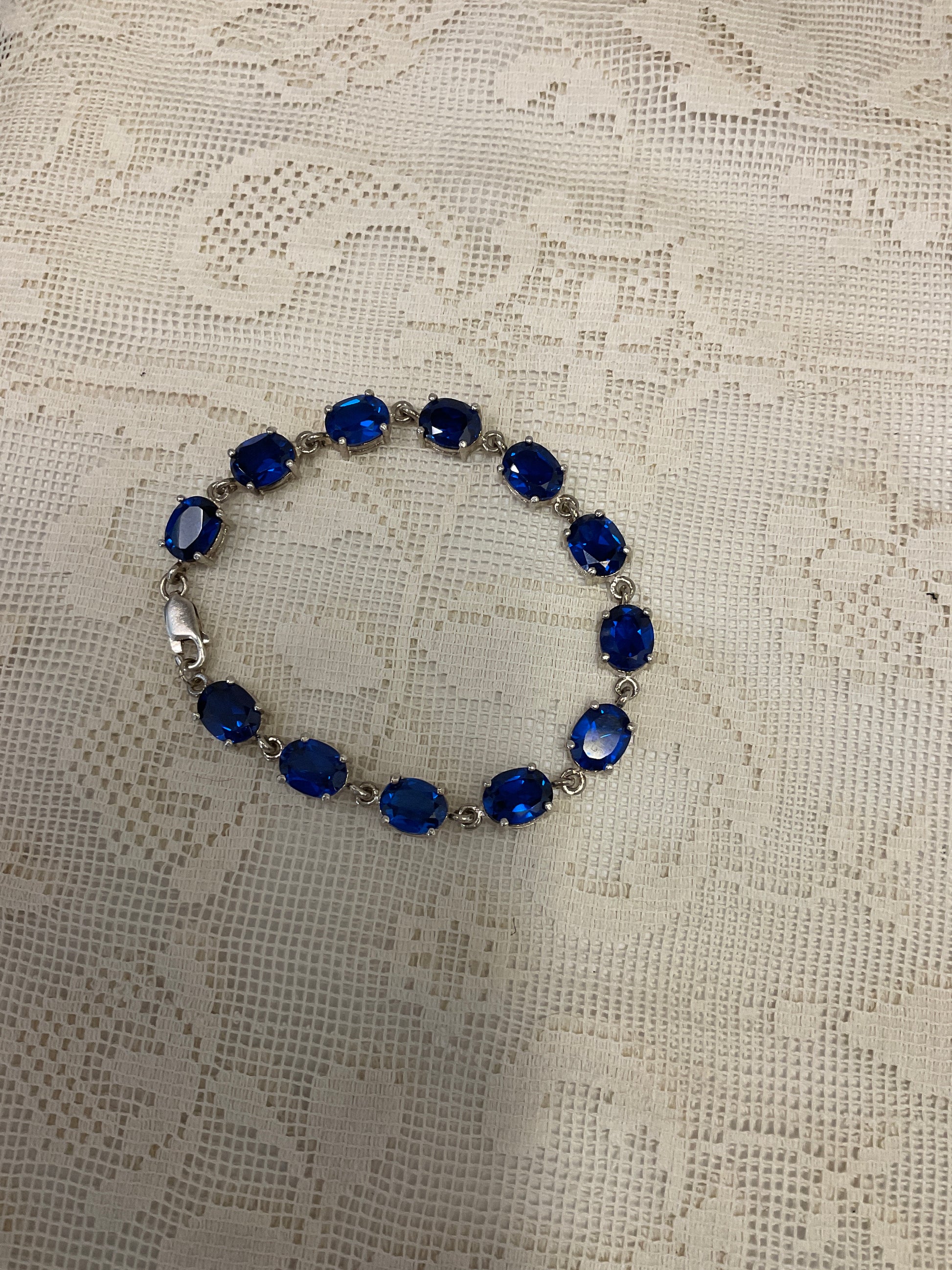 Blue sapphire like gemstones on silver bracelet 925