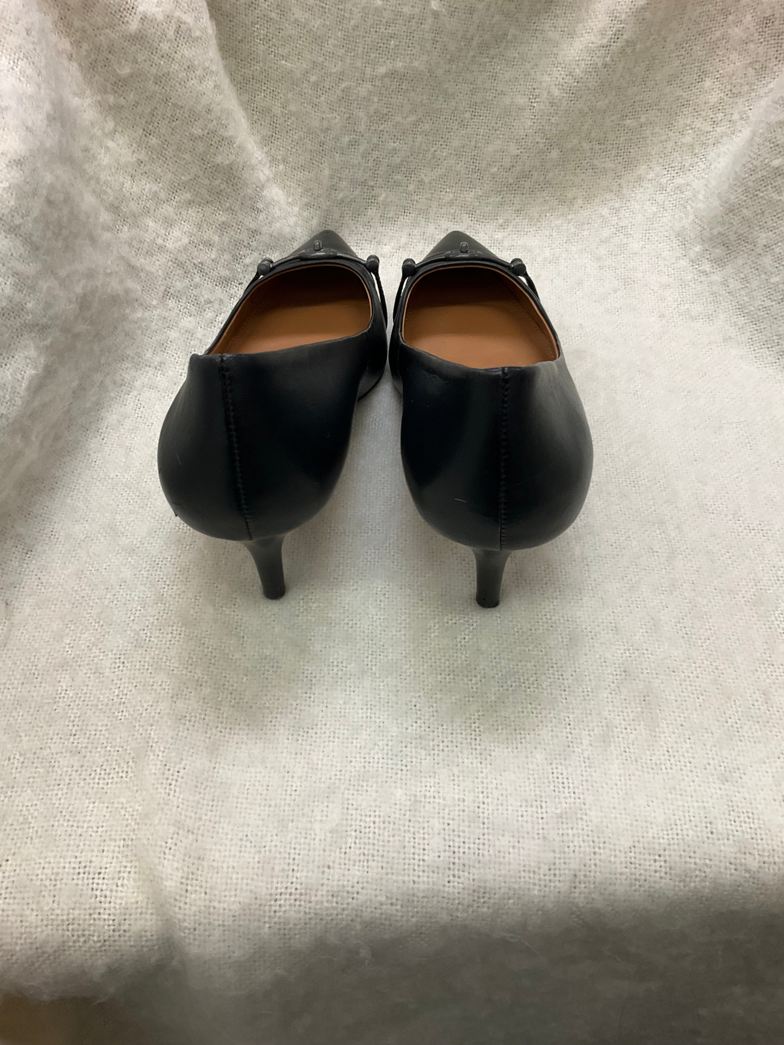 Coach Stylish black Coach pointed toe heels. Has silver-tone horsebit detail on front. Kitten heels. Size 10B.