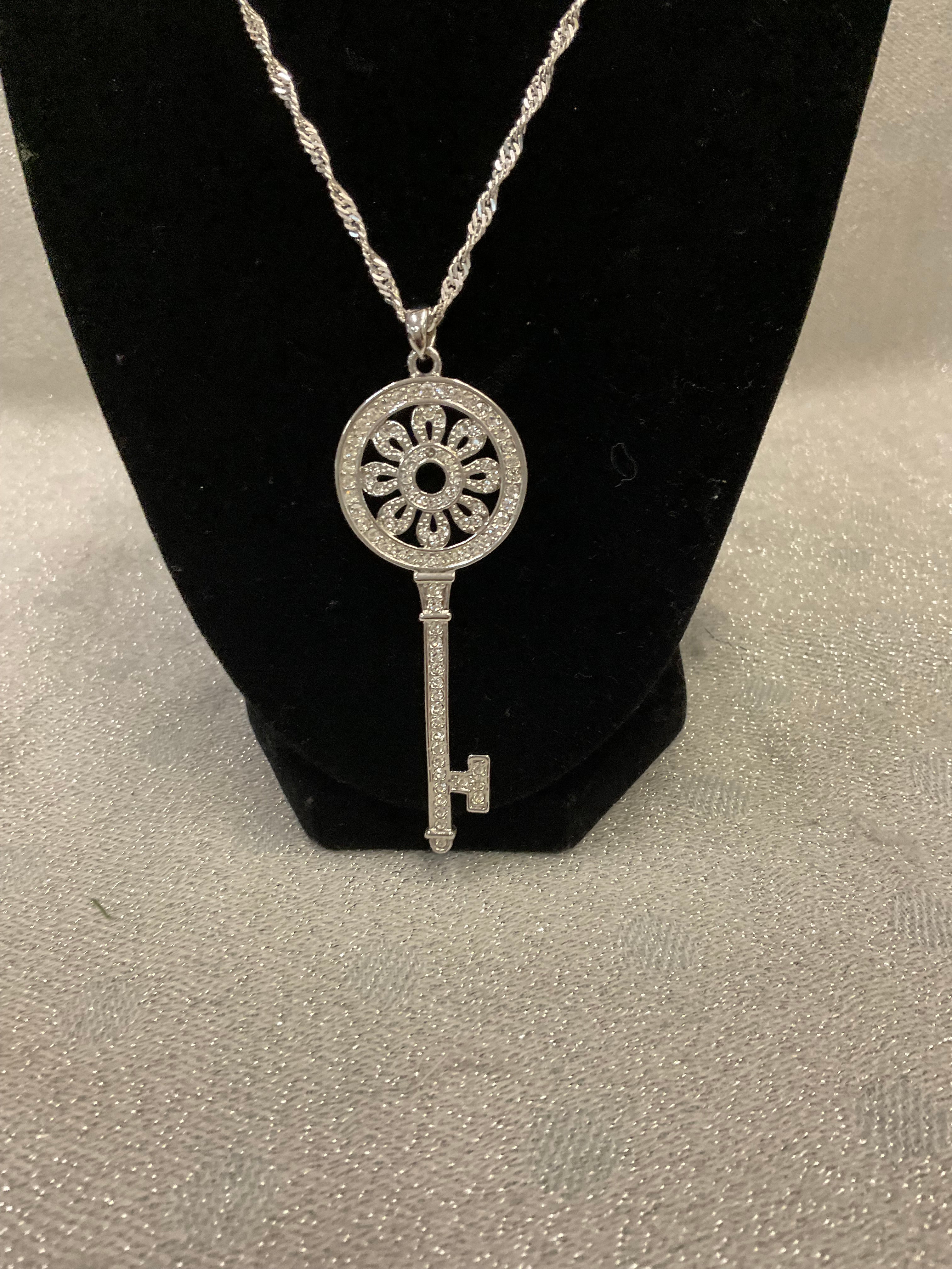 Silver necklace with large key pendant