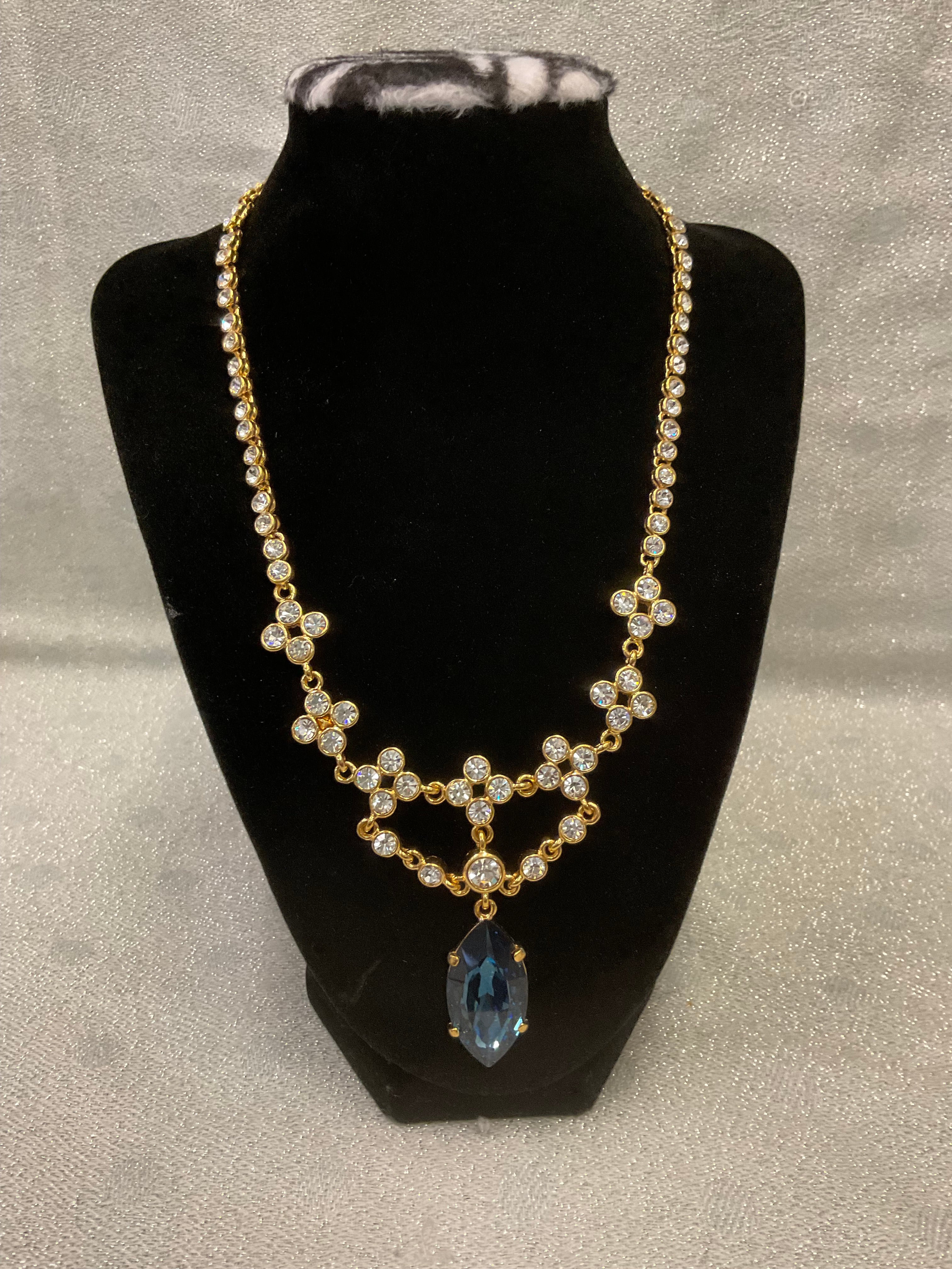 Vintage gold tone rhinestone necklace with large blue teardrop crystal pendant