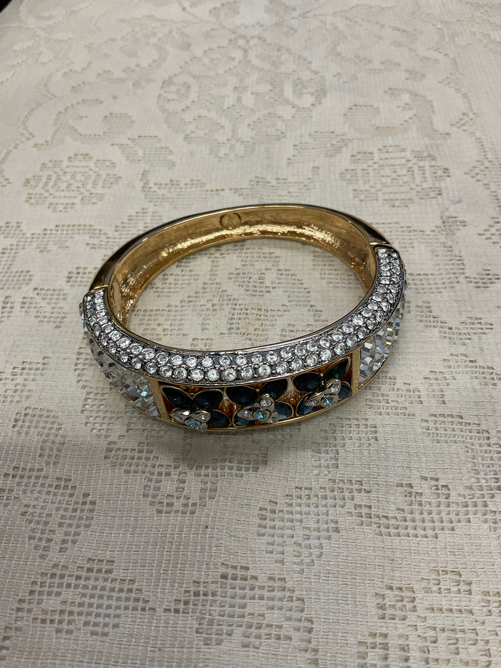 Cz and blue Cz flowers on gold cuff