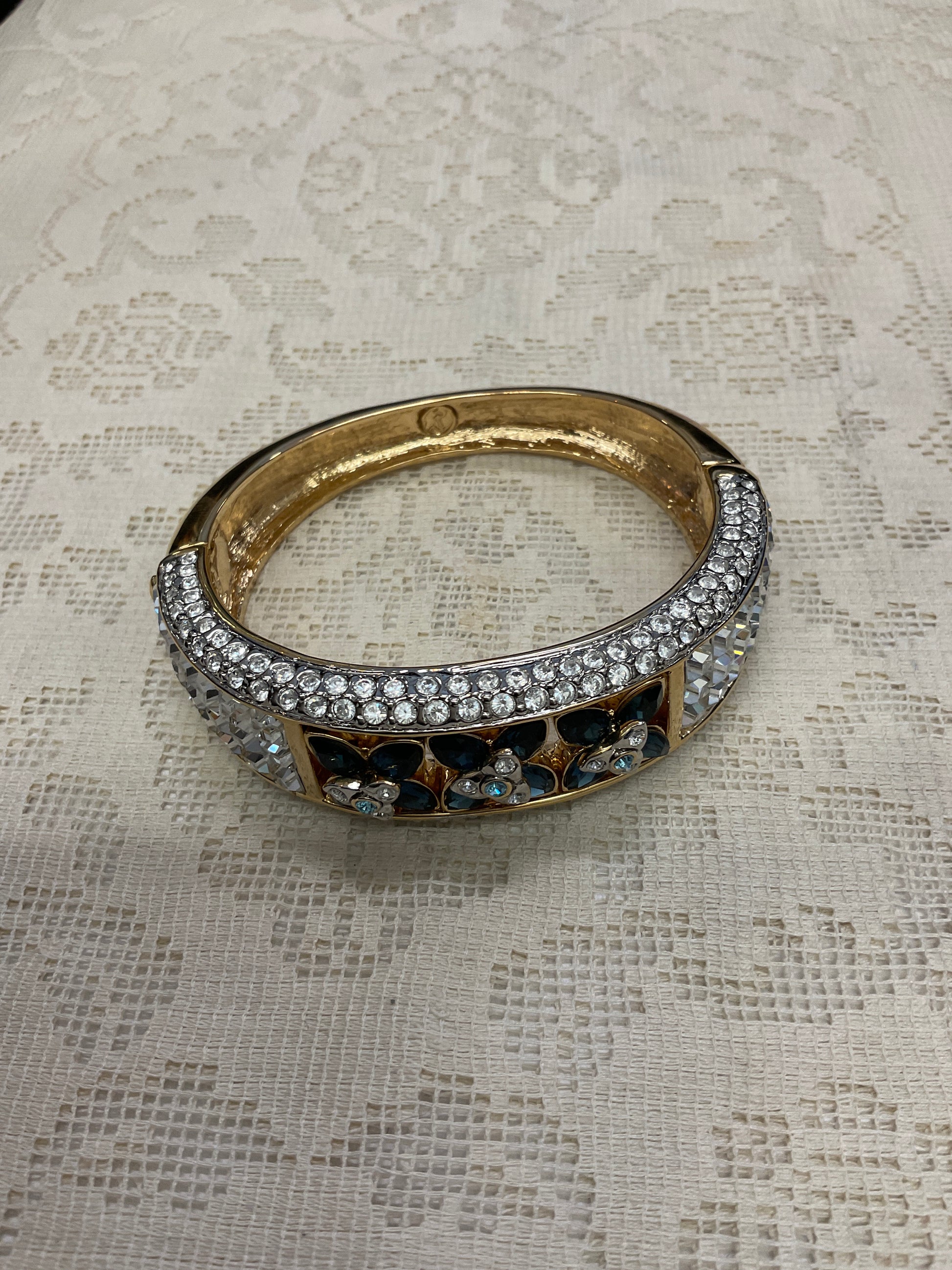 Cz and blue Cz flowers on gold cuff