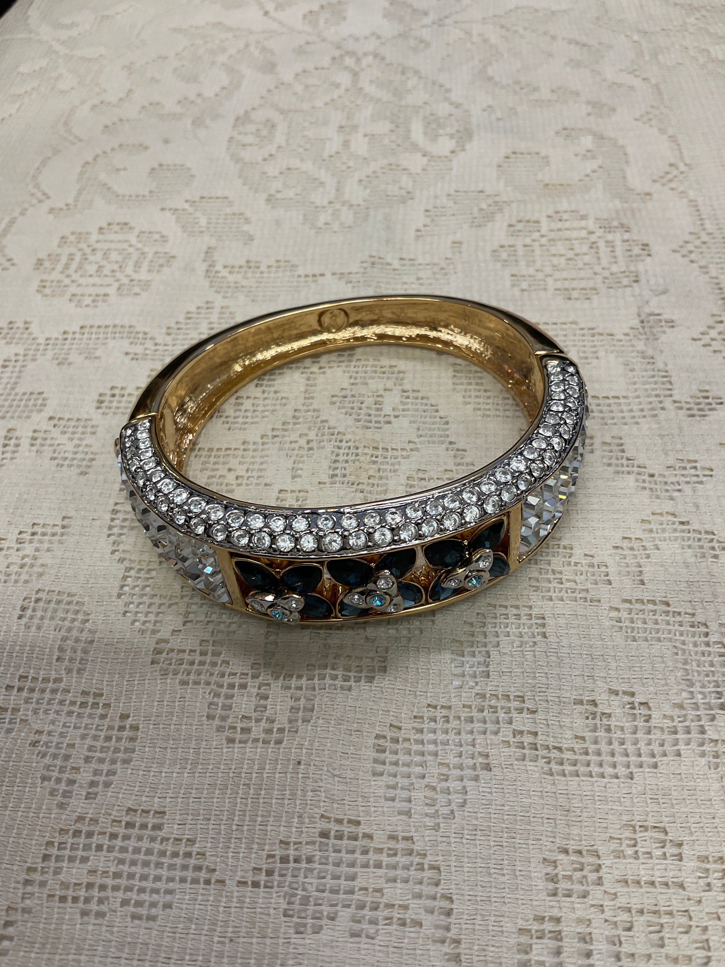 Cz and blue Cz flowers on gold cuff