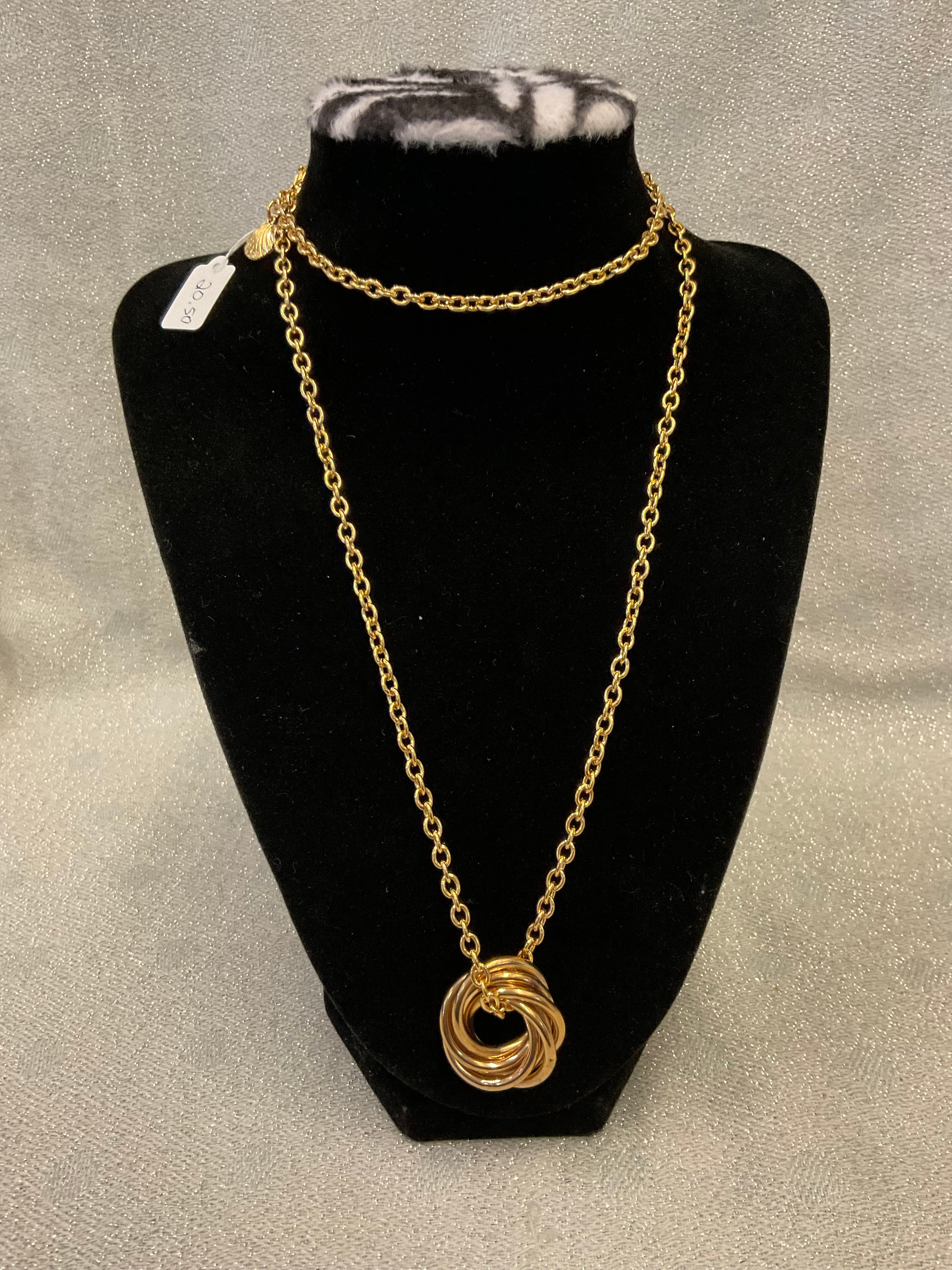 Gold tone long chain necklace with a multi ring pendant