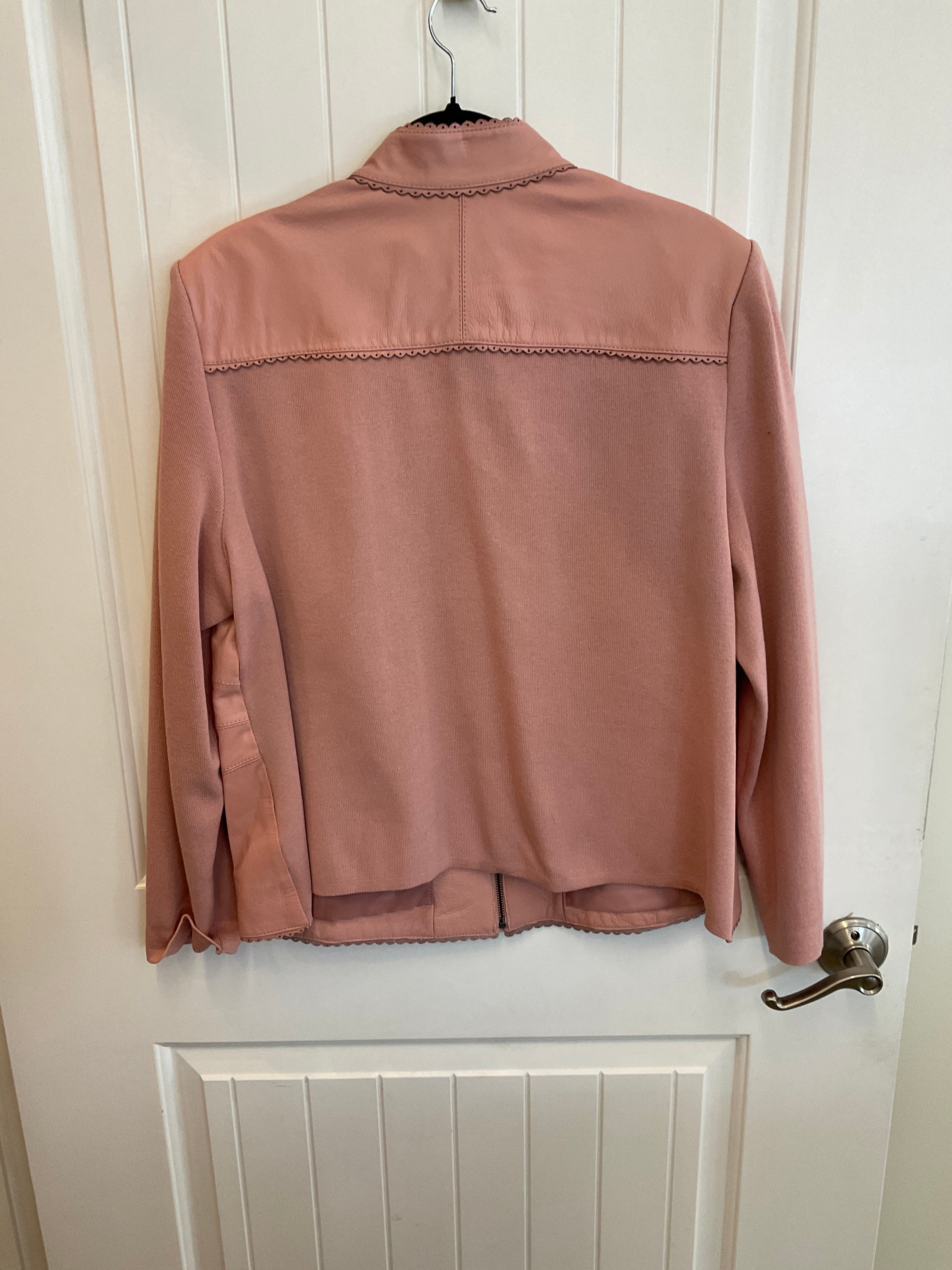 Pink leather jacket with knit sleeves