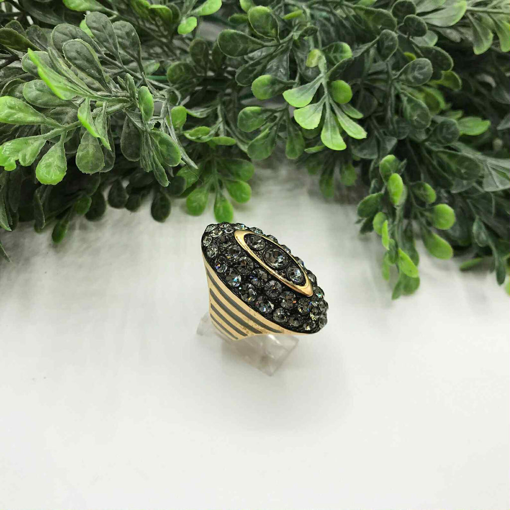 Vintage Akkad ring 6.5 gold toned elongated oval with rhinestones and grey enamel.