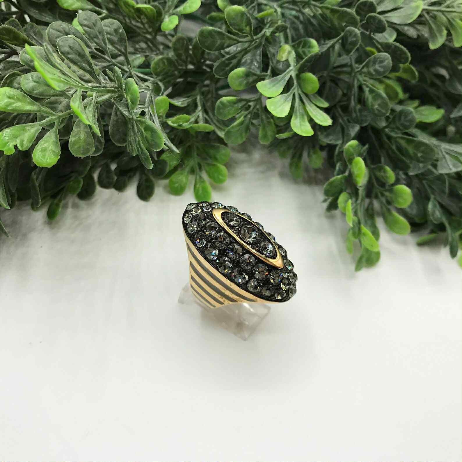 Vintage Akkad ring 6.5 gold toned elongated oval with rhinestones and grey enamel.