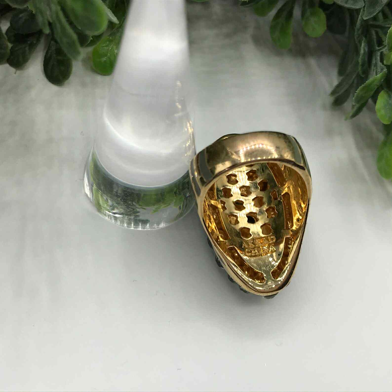 Vintage Akkad ring 6.5 gold toned elongated oval with rhinestones and grey enamel.