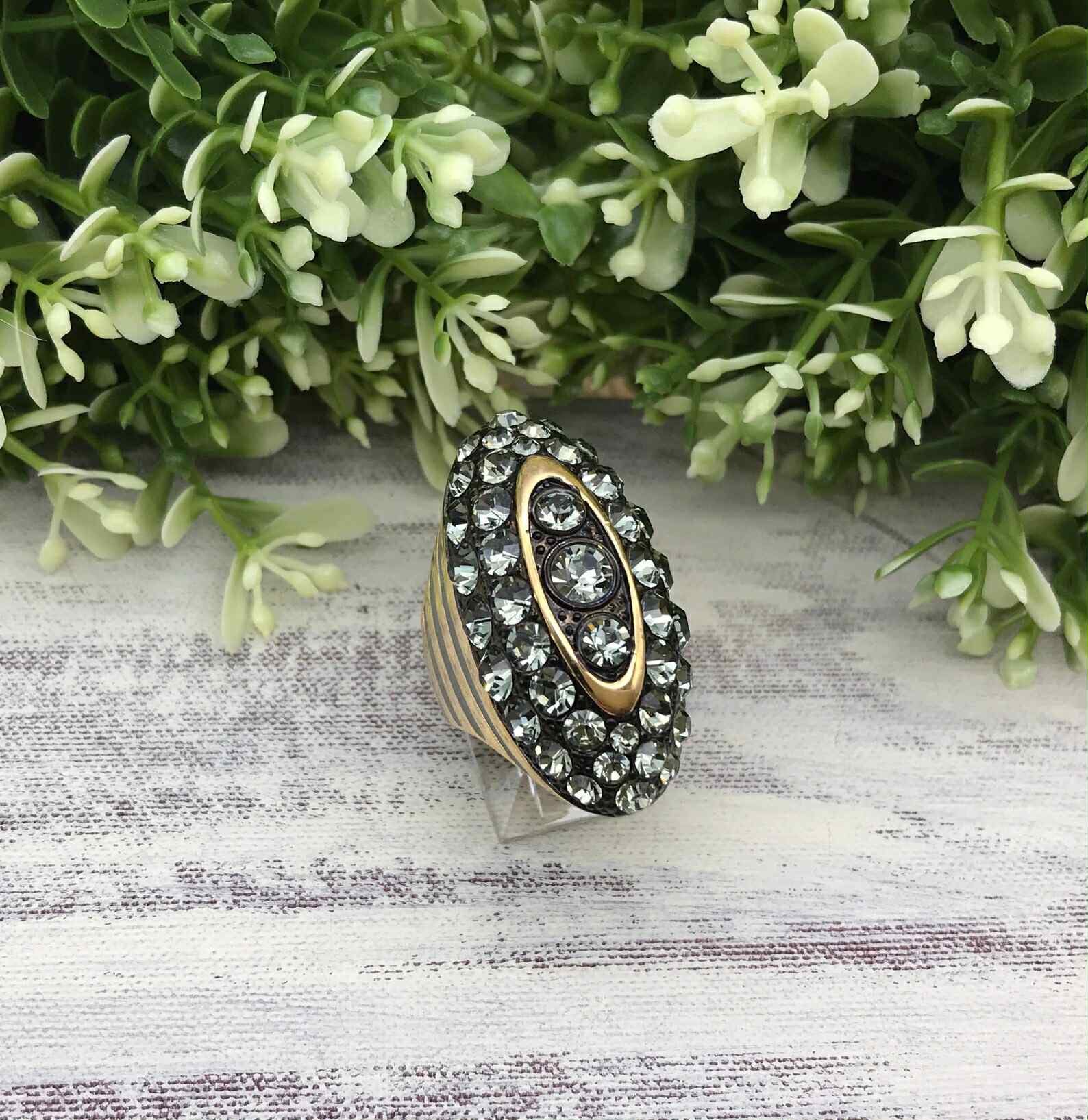 Vintage Akkad ring 6.5 gold toned elongated oval with rhinestones and grey enamel.