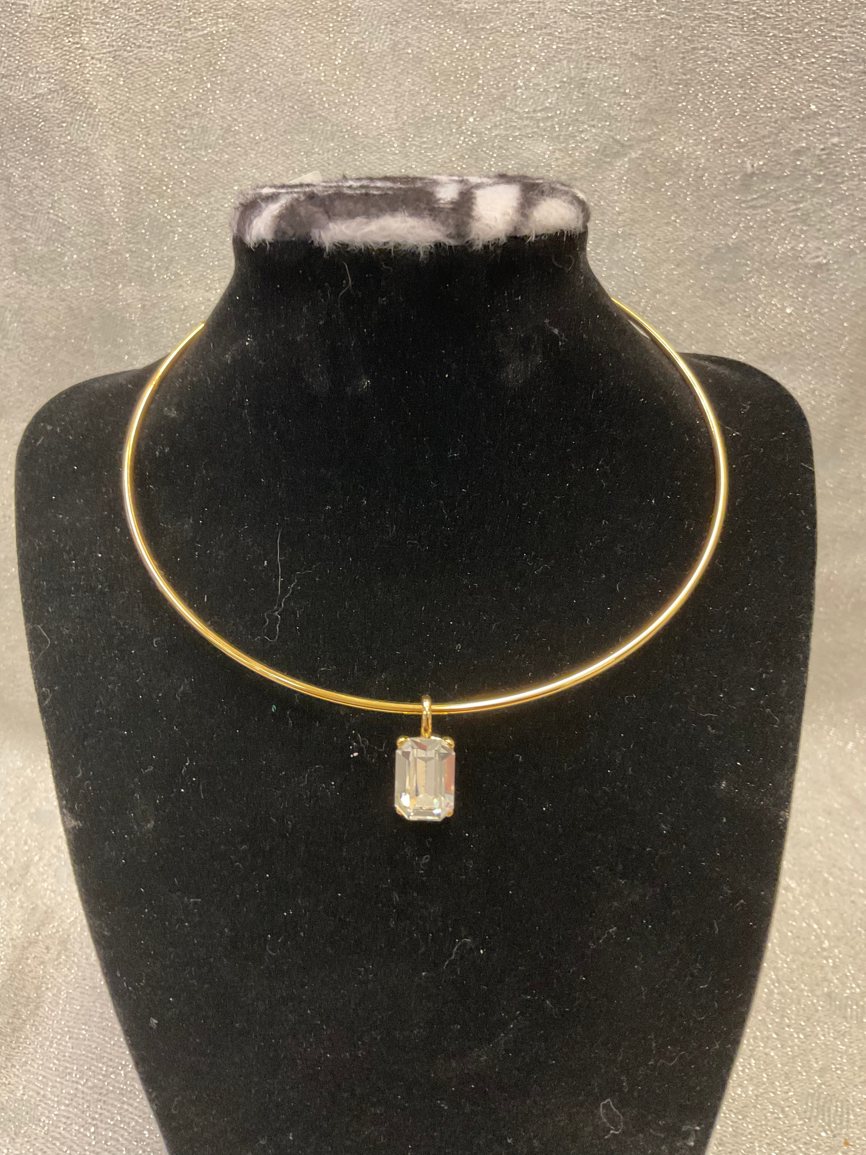 Gold choker necklace with gem pendant
