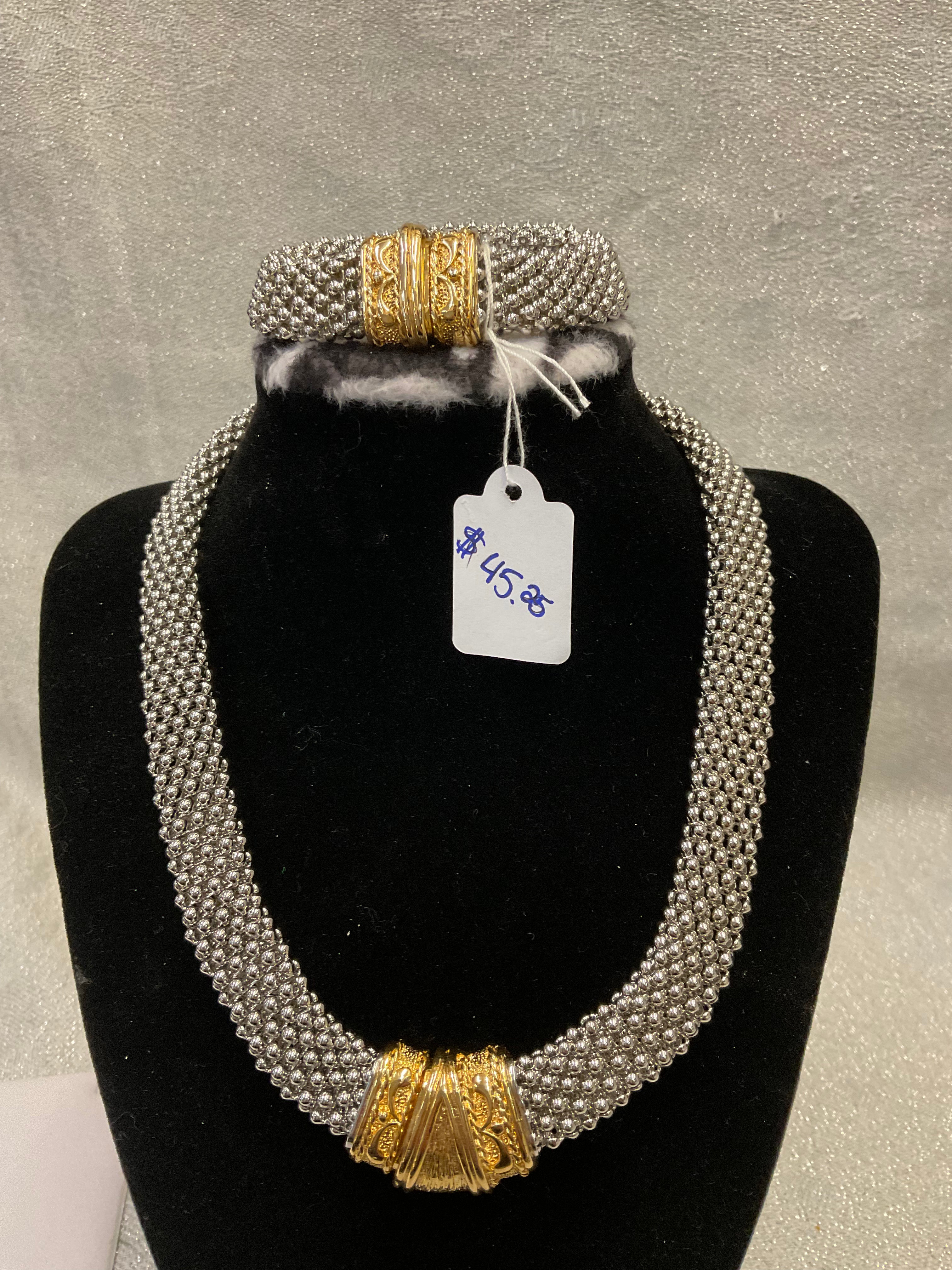 Silver and gold necklace and bracelet