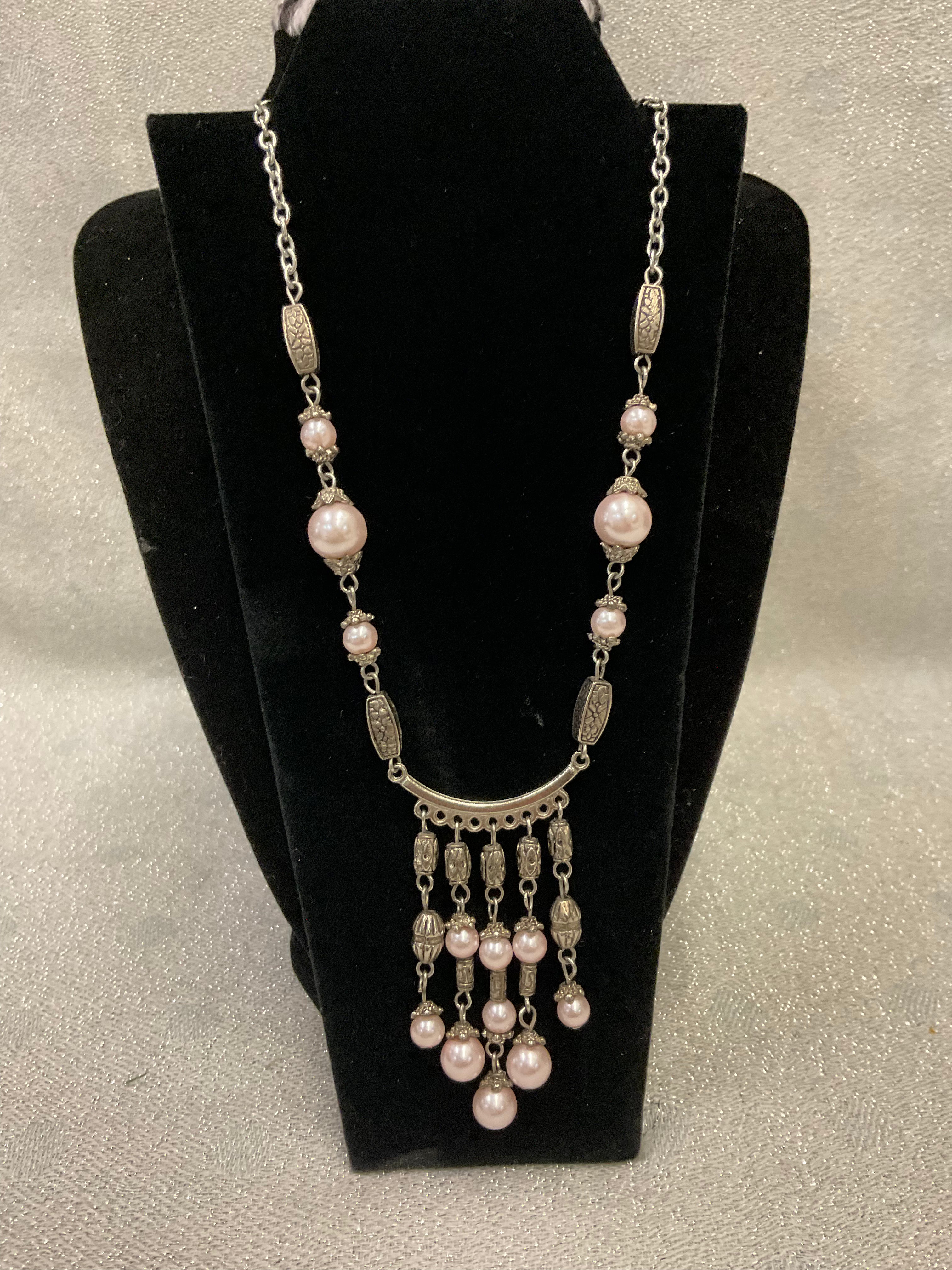 Silver toned statement necklace with pink pearls