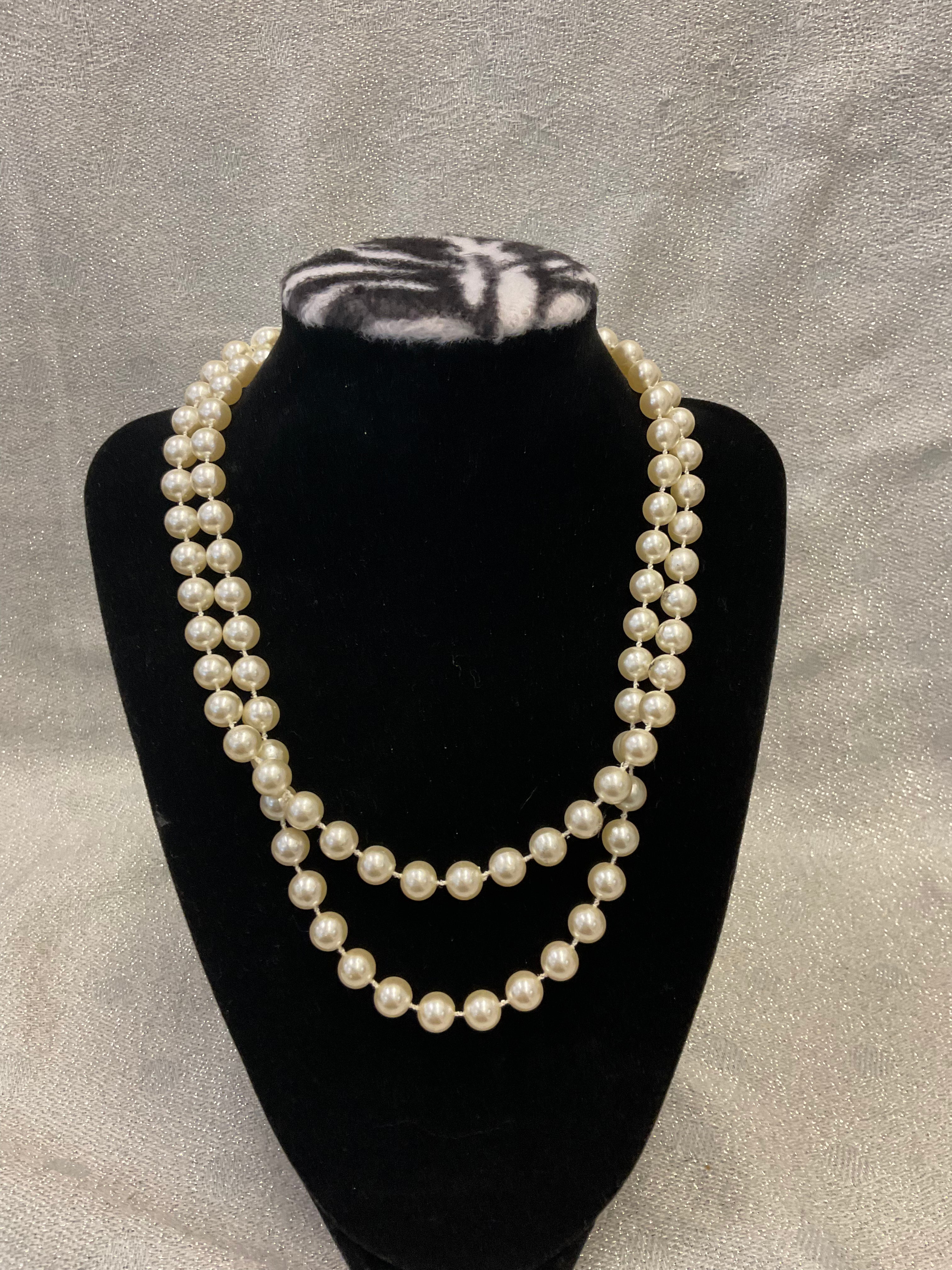Faux single stranded long pearl necklace