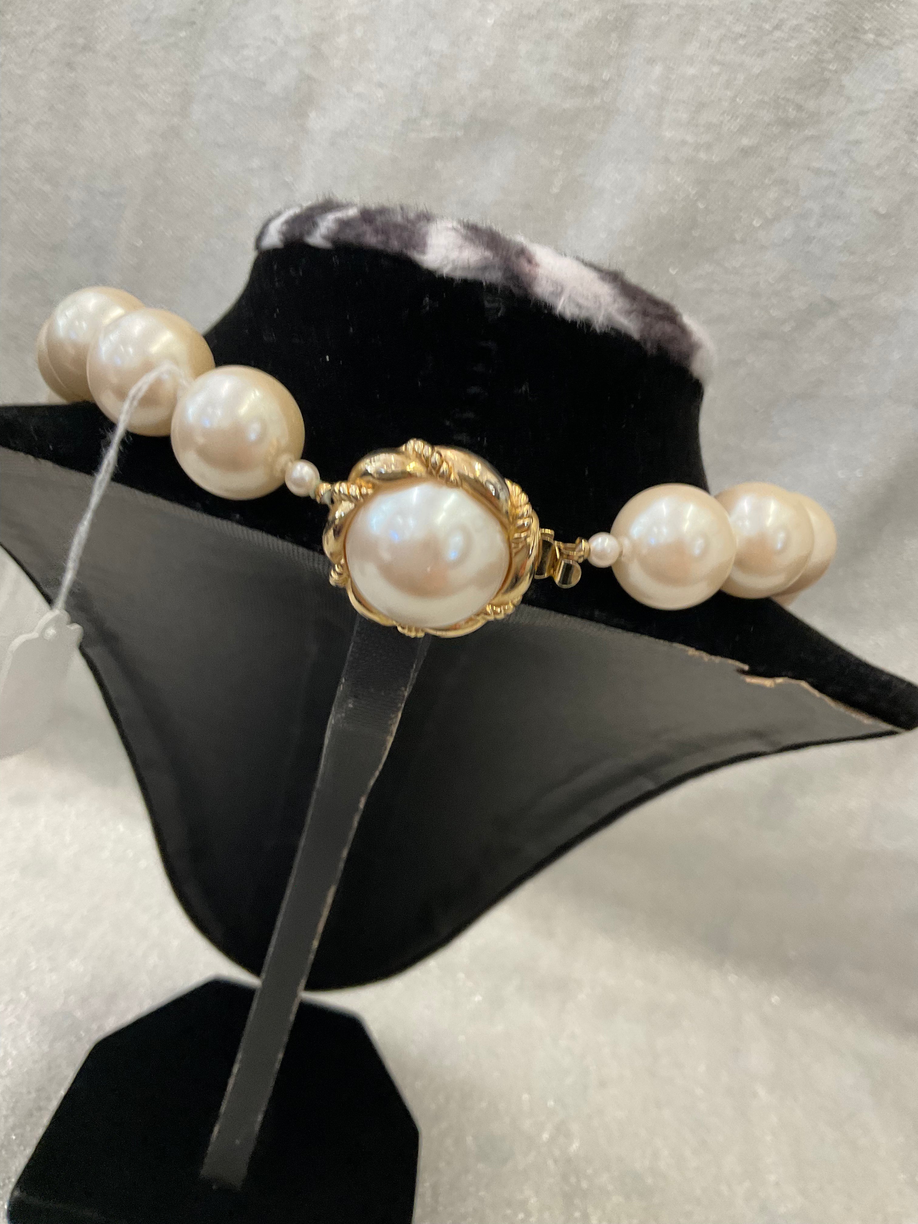 Large pearl necklace with statement clasp