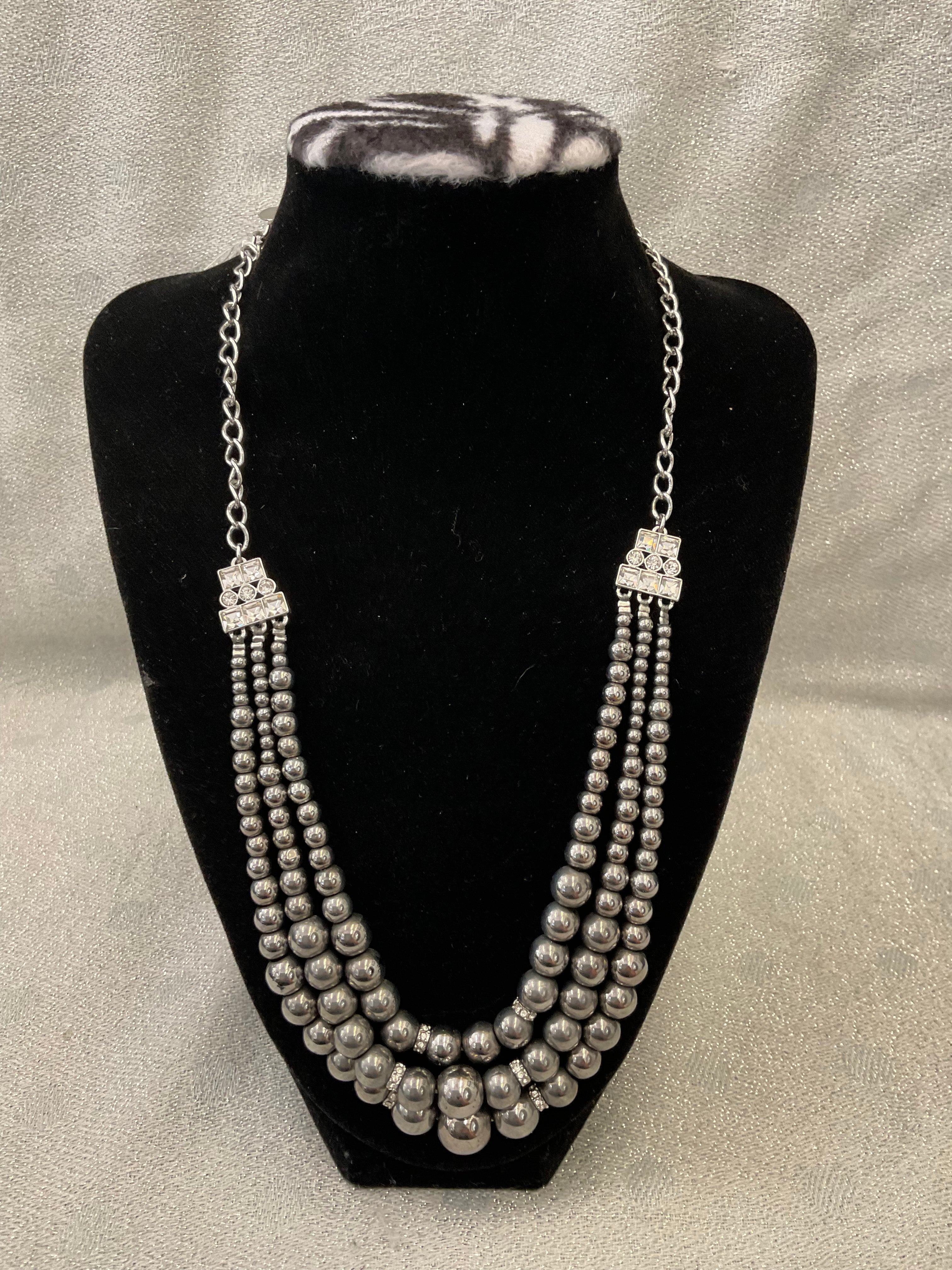 Triple stranded silver beaded necklace